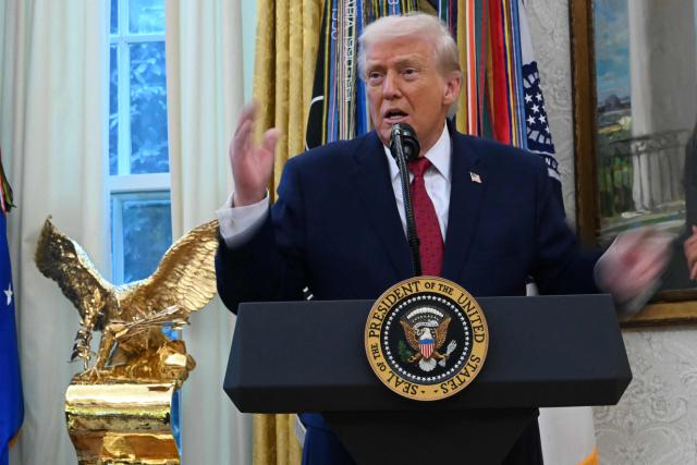 US President Donald Trump speaks during a Mexican Border Defense Medal presentation in the Oval Office of the White House in Washington, DC, on December 15, 2025. (Photo by ANDREW CABALLERO-REYNOLDS / AFP)