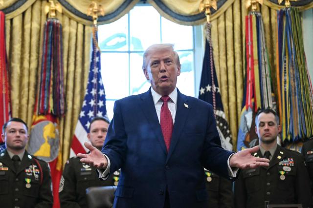 US President Donald Trump speaks during a Mexican Border Defense Medal presentation in the Oval Office of the White House in Washington, DC, on December 15, 2025. (Photo by ANDREW CABALLERO-REYNOLDS / AFP)