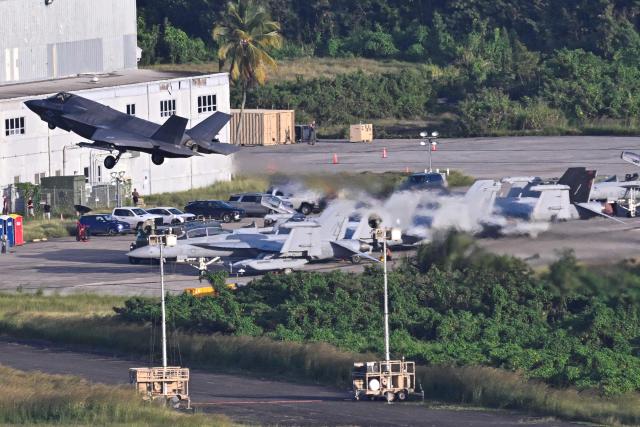 A US Marine Corps F-35B fighter jet takes off from José Aponte de la Torre Airport, formerly Roosevelt Roads Naval Station, on December 15, 2025 in Ceiba, Puerto Rico. Aircraft movements and coordinated exercises were observed throughout the day as part of heightened regional military readiness linked to ongoing operations at US military bases and maritime security efforts in the Caribbean. President Donald Trump administration is conducting a military campaign in the Caribbean and eastern Pacific, deploying naval and air forces for what it calls an anti-drugs offensive. (Photo by Miguel J. Rodriguez Carrillo / AFP)