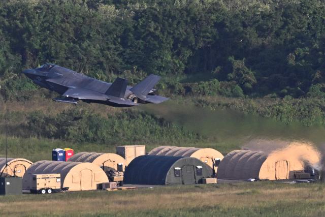 A US Marine Corps F-35B fighter takes off from José Aponte de la Torre Airport, formerly Roosevelt Roads Naval Station, on December 15, 2025 in Ceiba, Puerto Rico. Aircraft movements and coordinated exercises were observed throughout the day as part of heightened regional military readiness linked to ongoing operations at US military bases and maritime security efforts in the Caribbean. President Donald Trump administration is conducting a military campaign in the Caribbean and eastern Pacific, deploying naval and air forces for what it calls an anti-drugs offensive. (Photo by Miguel J. Rodriguez Carrillo / AFP)