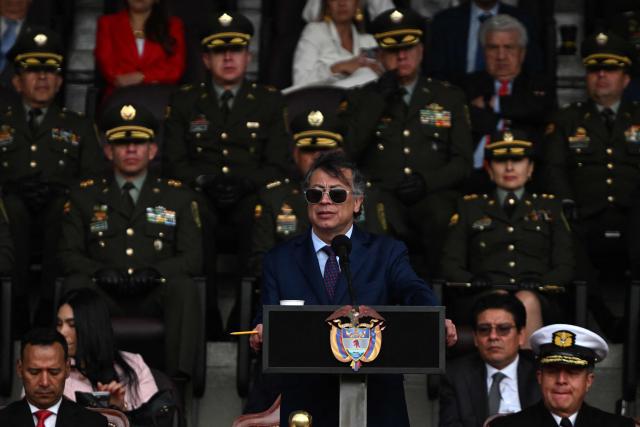 Colombia's President Gustavo Petro (C) speaks during a promotion ceremony for senior officials at the General Santander Police Academy (ECSAN) in Bogota on December 15, 2025. (Photo by LUIS ACOSTA / AFP)