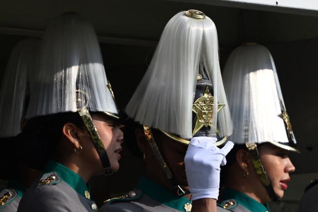 Cadets attend a promotion ceremony for senior officials presided over by Colombia's President Gustavo Petro at the General Santander Police Academy (ECSAN) in Bogota on December 15, 2025. (Photo by LUIS ACOSTA / AFP)