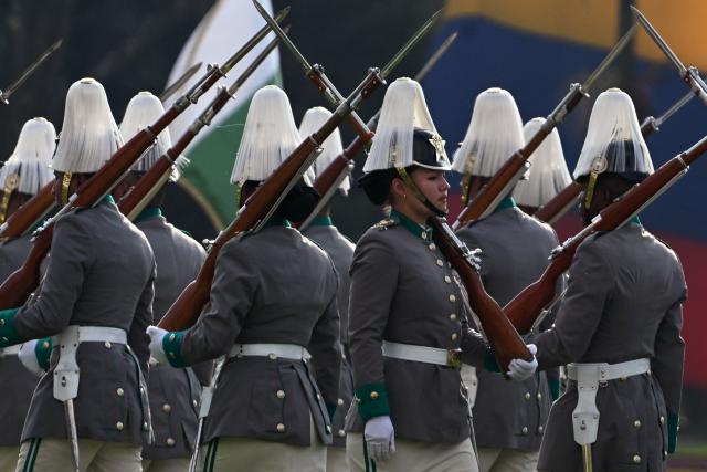Cadets march during a promotion ceremony for senior officials presided over by Colombia's President Gustavo Petro at the General Santander Police Academy (ECSAN) in Bogota on December 15, 2025. (Photo by LUIS ACOSTA / AFP)