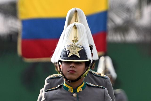 Cadets attend a promotion ceremony for senior officials presided over by Colombia's President Gustavo Petro at the General Santander Police Academy (ECSAN) in Bogota on December 15, 2025. (Photo by LUIS ACOSTA / AFP)