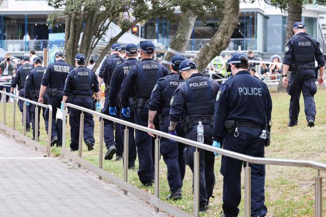 The police search for evidence around the area where the Bondi Beach shooting took place in Sydney on December 16, 2025. Australia's leaders have agreed to toughen gun laws after attackers killed 15 people at a Jewish festival on Bondi Beach, the worst mass shooting in decades decried as antisemitic "terrorism" by authorities. (Photo by DAVID GRAY / AFP)