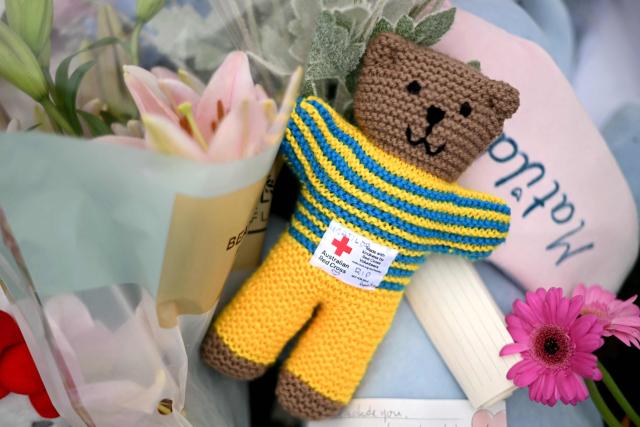An Australian Red Cross “Trauma Teddy” lies with tributes from mourners at the Bondi Pavilion in memory of the victims of a shooting at Bondi Beach, in Sydney on December 16, 2025. Australia's leaders have agreed to toughen gun laws after attackers killed 15 people at a Jewish festival on Bondi Beach, the worst mass shooting in decades decried as antisemitic "terrorism" by authorities. (Photo by Saeed KHAN / AFP)