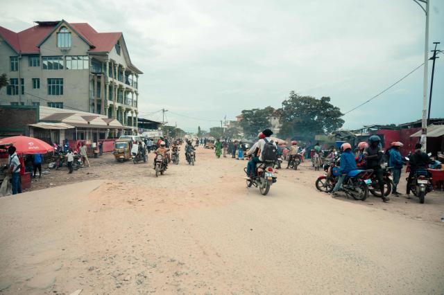 (FILES) Passengers are driven on motorbike taxis along a road in Uvira on December 9, 2025. The M23 armed group said on December 16, 2025, it had agreed to a request from the United States to withdraw from the key city of Uvira in eastern Democratic Republic of Congo.
The group "will unilaterally withdraw its forces from the city of Uvira, as requested by the US mediators", it said in a statement signed by coordinator Corneil Nangaa. (Photo by AFP)