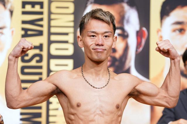 Japan's Seiya Tsutsumi poses for photos at an official weigh-in in Tokyo on December 16, 2025, ahead of the WBA Bantamweight title match with Philippines' Nonito Donaire  on December 17 at Tokyo's Kokugikan. (Photo by Kazuhiro NOGI / AFP)