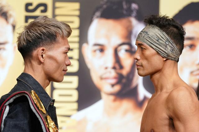 Japan's Seiya Tsutsumi (L) and Philippines' Nonito Donaire face off at an official weigh-in in Tokyo on December 16, 2025, ahead of their WBA Bantamweight title match on December 17 at Tokyo's Kokugikan. (Photo by Kazuhiro NOGI / AFP)