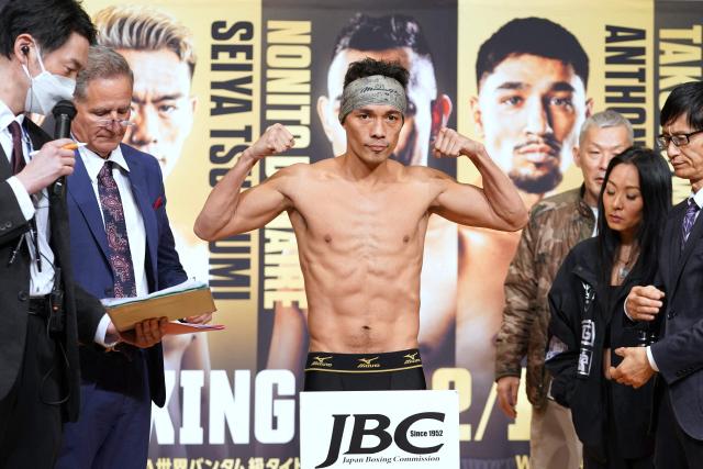 Philippines' Nonito Donaire poses for photos at an official weigh-in in Tokyo on December 16, 2025, ahead of the WBA Bantamweight title match with Japan's Seiya Tsutsumi on December 17 at Tokyo's Kokugikan. (Photo by Kazuhiro NOGI / AFP)