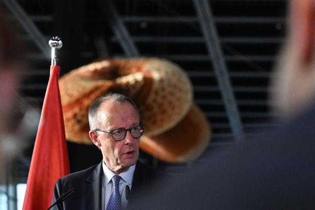 German Chancellor Friedrich Merz addresses a press conference during his visit of the new Terminal 3 at Frankfurt Airport (FRA) in Frankfurt am Main, western Germany on December 16, 2025, as part of his inaugural visit to the German state of Hesse. Fraport will open the new Terminal 3 on April 22, 2026. (Photo by Kirill KUDRYAVTSEV / AFP)