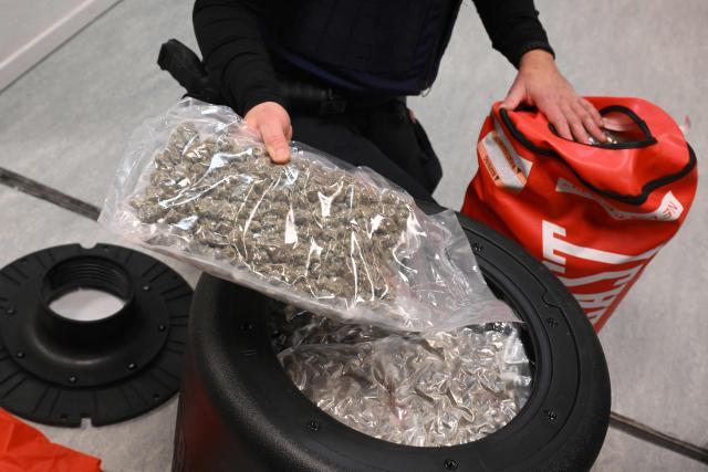 This photograph shows cannabis hidden in a boxing punching bag seized by customs officers at Brussels Airport (Zaventem), during a press conference intended to present an overview of drug seizures in 2025, in Machelen on December 16, 2025. (Photo by Nicolas TUCAT / AFP)