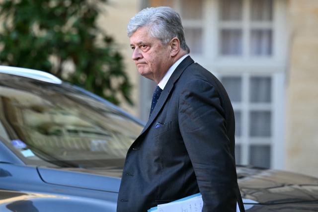 France’s junior Minister in charge of external trade Nicolas Forissier reacts as he leaves the Hotel Matignon after a meeting with The Prime Minister, government ministers and prefects on agricultural policy in Paris on December 16, 2025. The Prime Minister held a meeting on agriculture at the Hotel Matignon on December 16, 2025, as farmers criticize the government's handling of lumpy skin disease (dermatose nodulaire contagieuse) affecting livestock, and oppose the signing of a free trade agreement with Mercosur. (Photo by Blanca CRUZ / AFP)