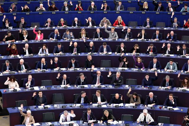 Members of the European Parliament take part in a vote during a plenary session  at the European Parliament in Strasbourg, eastern France, on December 16, 2025. (Photo by FREDERICK FLORIN / AFP)