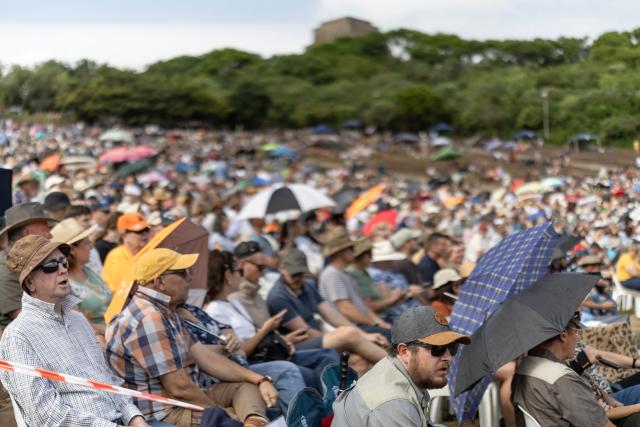 Attendees sing hymns during a church service as Afrikaners gather to celebrate the Day of the Vow (Geloftedag) at the Voortrekker Monument in Pretoria on December 16, 2025. The Day of the Vow (Geloftedag), which has since been renamed Reconciliation Day, is celebrated by traditional Afrikaners as the day they defeated the Zulu's at the Battle of Blood River, in KwaZulu Natal, on December 16, 1838. (Photo by Wikus de Wet / AFP)