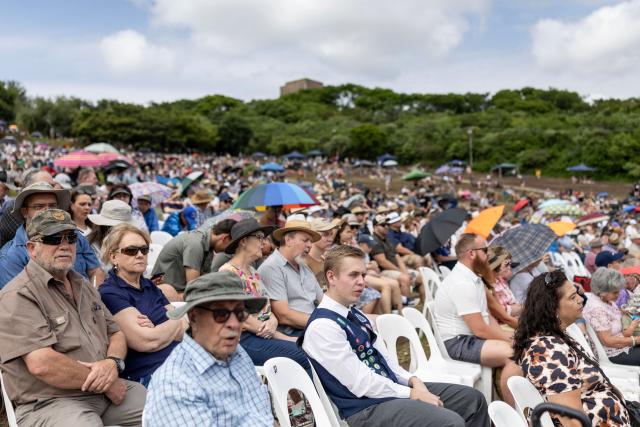 Attendees sing hymns during a church service as Afrikaners gather to celebrate the Day of the Vow (Geloftedag) at the Voortrekker Monument in Pretoria on December 16, 2025. The Day of the Vow (Geloftedag), which has since been renamed Reconciliation Day, is celebrated by traditional Afrikaners as the day they defeated the Zulu's at the Battle of Blood River, in KwaZulu Natal, on December 16, 1838. (Photo by Wikus de Wet / AFP)