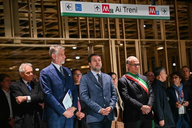 Italy's Minister of Culture Alessandro Giuli (2ndL), Deputy Prime Minister of Italy and Minister of Infrastructure and Transporton, Matteo Salvini and Rome's Mayor Roberto Gualtieri attend the opening ceremony of the Colosseo and Porta Metronia new Metro stations, designed as a museum to showcase the archaeological findings uncovered during its construction, in Rome on December 16, 2025. (Photo by Filippo MONTEFORTE / AFP)