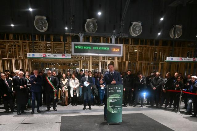 Italy's deputy premier and infrastrusctions Minister Matteo Salvini (C) delivers a speech for the opening ceremony of the Colosseo and Porta Metronia new Metro stations, designed as a museum to showcase the archaeological findings uncovered during its construction, in Rome on December 16, 2025. (Photo by Filippo MONTEFORTE / AFP)