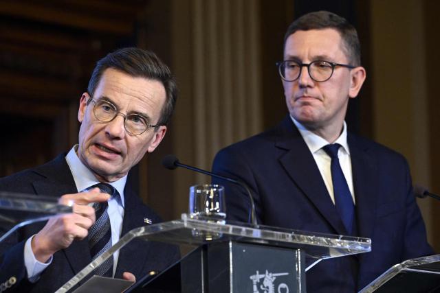Swedish Prime Minister Ulf Kristersson and Estonian Prime Minister Kristen Michal (R) address a press conference following the EU Eastern Flank Summit in Helsinki, Finland, on December 16, 2025. Defending Europe's eastern flank is an "immediate" priority for the European Union in the face of the threat posed by Russia, eight EU leaders meeting in Helsinki said on December 16. (Photo by Heikki Saukkomaa / Lehtikuva / AFP) / Finland OUT
