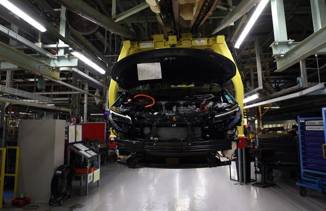 A car is pictured during a media tour of the Nissan Leaf electric car production line, at the Nissan factory in Sunderland, north-east England, on December 16, 2025. Nissan on December 16, 2025, commenced production of its new electric Leaf vehicle at the car manufacturer's Sunderland plant. (Photo by Scott Heppell / AFP)
