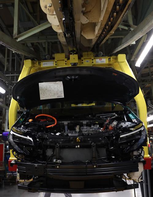 A car is pictured during a media tour of the Nissan Leaf electric car production line, at the Nissan factory in Sunderland, north-east England, on December 16, 2025. Nissan on December 16, 2025, commenced production of its new electric Leaf vehicle at the car manufacturer's Sunderland plant. (Photo by Scott Heppell / AFP)
