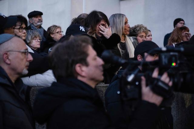 A woman reacts during a tribute to Frenchman Dan Elkayam, one of the victims killed during a shooting at an event for the Jewish festival of Hanukkah on Bondi Beach in Sydney, in Le Bourget, northern France, on December 16, 2025. Sajid Akram and his son Naveed opened fire on people thronging the famous beach for the Jewish festival of Hanukkah on December 14, 2025 evening, killing 15 people and wounding dozens more. Authorities said the attack was designed to sow panic among the nation's Jews, but have so far given little detail about the gunmen's deeper motivations. (Photo by Blanca CRUZ / AFP)
