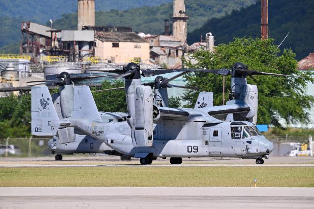 A US Marine CH-53 Sea Stallion prepares for landing at Mercedita International Airport on December 16, 2025 in Ponce, Puerto Rico. Aircraft movements and coordinated exercises were observed throughout the day as part of heightened regional military readiness linked to ongoing operations at US military bases and maritime security efforts in the Caribbean. President Donald Trump administration is conducting a military campaign in the Caribbean and eastern Pacific, deploying naval and air forces for what it calls an anti-drugs offensive. (Photo by Miguel J. Rodriguez Carrillo / AFP)