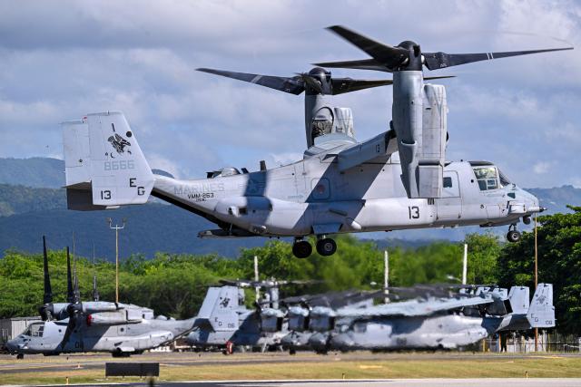 A US Marine CH-53 Sea Stallion prepares for landing at Mercedita International Airport on December 16, 2025 in Ponce, Puerto Rico. Aircraft movements and coordinated exercises were observed throughout the day as part of heightened regional military readiness linked to ongoing operations at US military bases and maritime security efforts in the Caribbean. President Donald Trump administration is conducting a military campaign in the Caribbean and eastern Pacific, deploying naval and air forces for what it calls an anti-drugs offensive. (Photo by Miguel J. Rodriguez Carrillo / AFP)
