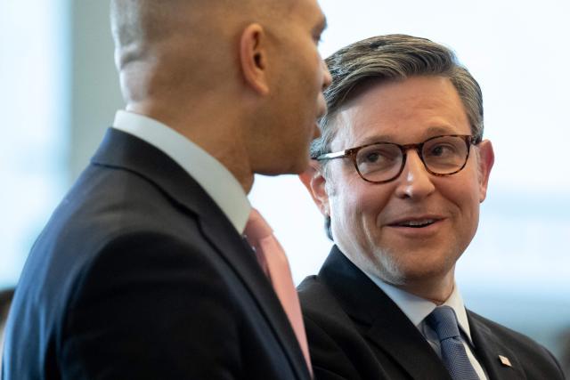 US Speaker of the House Mike Johnson (R-LA) and US House Minority Leader Hakeem Jeffries (D-NY) speak during a dedication and unveiling of a statue of civil rights activist Barbara Rose Johns of Virginia, in Emancipation Hall on Capitol Hill in Washington, DC, December 16, 2025. In 1951, a 16-year-old Johns, led a walkout at her segregated high school, and now her statue replaces one of confederal General Robert E. Lee, which was removed from the Capitol in 2020. (Photo by SAUL LOEB / AFP)