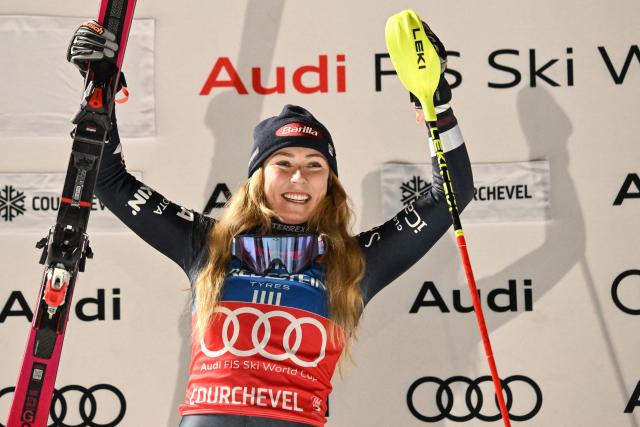 US' Mikaela Shiffrin celebrates on the podium after winning the FIS Alpine Skiing women's World Cup 2025-2026 slalom in Courchevel, French Alps, on December 16, 2025. (Photo by Jeff PACHOUD / AFP)