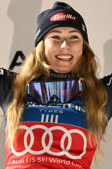 US' Mikaela Shiffrin celebrates on the podium after winning the FIS Alpine Skiing women's World Cup 2025-2026 slalom in Courchevel, French Alps, on December 16, 2025. (Photo by Jeff PACHOUD / AFP)