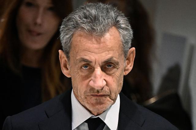(FILES) Former French president Nicolas Sarkozy leaves the court after the verdict in his trial for illegal campaign financing from Libya for his successful 2007 presidential bid, at the Tribunal de Paris courthouse in Paris, on September 25, 2025. French prosecutors on December 17, 2025 announced that they were seeking indictments against the former French President, his wife and nine others in an alleged witness-tampering case. (Photo by JULIEN DE ROSA / AFP)