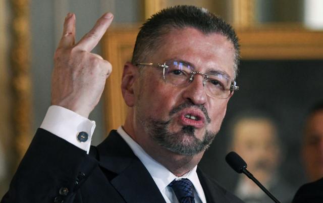 (FILES) Costa Rica's President Rodrigo Chaves speaks during a ceremony with Panama's President Jose Raul Mulino (not in frame) at the National Theater in San Jose, on November 21, 2025. Rodrigo Chaves faces Congress on December 16, 2025, over the possibility of losing his immunity, a step toward possible removal for allegedly influencing the 2026 election campaign. (Photo by EZEQUIEL BECERRA / AFP)