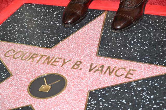 US actor Courtney B. Vance (detail shoes) poses on his star during his Hollywood Walk of Fame unveiling ceremony in Hollywood, California, on December 16, 2025. (Photo by Robyn Beck / AFP)