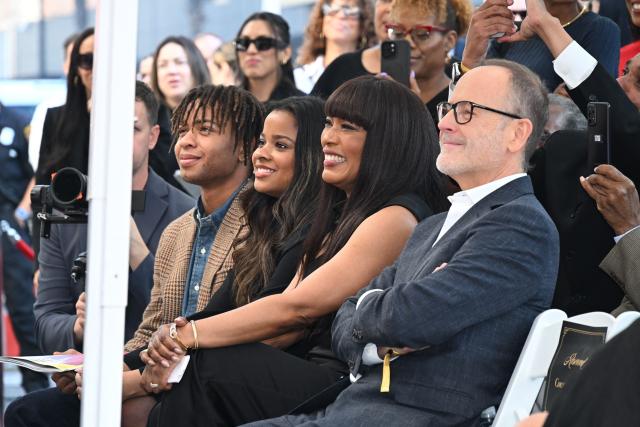 US actor Angela Bassett (2R), flanked by her children Bronwyn Vance (2L) and Slater Vance (L) and Chairman of FX Networks John Landgraf (R) attend the Hollywood Walk of Fame star unveiling ceremony for her husband actor Courtney B. Vance (not in photo), in Hollywood, California on December 16, 2025. (Photo by Robyn Beck / AFP)