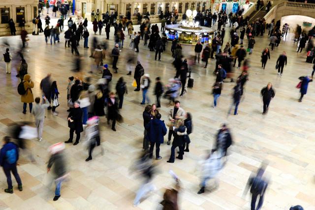 People walk through Grand Central Station in the Manhattan borough of New York City on December 16, 2025. (Photo by CHARLY TRIBALLEAU / AFP)