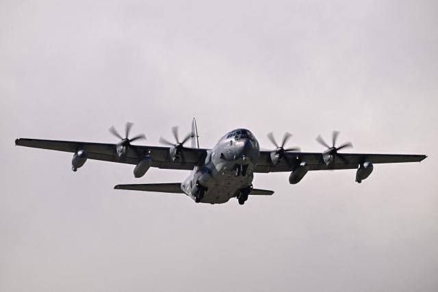 A US Air Force C-130 Hercules prepares for landing at Mercedita International Airport on December 16, 2025 in Ponce, Puerto Rico. Aircraft movements and coordinated exercises were observed throughout the day as part of heightened regional military readiness linked to ongoing operations at US military bases and maritime security efforts in the Caribbean. President Donald Trump administration is conducting a military campaign in the Caribbean and eastern Pacific, deploying naval and air forces for what it calls an anti-drugs offensive. (Photo by Miguel J. Rodriguez Carrillo / AFP)