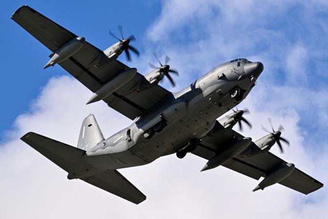 A US Air Force C-130 Hercules prepares for landing at Mercedita International Airport on December 16, 2025 in Ponce, Puerto Rico. Aircraft movements and coordinated exercises were observed throughout the day as part of heightened regional military readiness linked to ongoing operations at US military bases and maritime security efforts in the Caribbean. President Donald Trump administration is conducting a military campaign in the Caribbean and eastern Pacific, deploying naval and air forces for what it calls an anti-drugs offensive. (Photo by Miguel J. Rodriguez Carrillo / AFP)