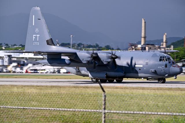 A US Air Force C-130 Hercules taxis at Mercedita International Airport on December 16, 2025 in Ponce, Puerto Rico. Aircraft movements and coordinated exercises were observed throughout the day as part of heightened regional military readiness linked to ongoing operations at US military bases and maritime security efforts in the Caribbean. President Donald Trump administration is conducting a military campaign in the Caribbean and eastern Pacific, deploying naval and air forces for what it calls an anti-drugs offensive. (Photo by Miguel J. Rodriguez Carrillo / AFP)