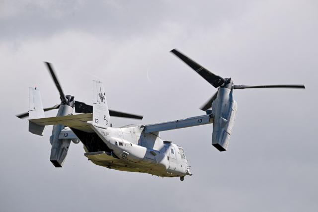 A US Marine Corps MV-22 Osprey departs from Mercedita International Airport on December 16, 2025 in Ponce, Puerto Rico. Aircraft movements and coordinated exercises were observed throughout the day as part of heightened regional military readiness linked to ongoing operations at US military bases and maritime security efforts in the Caribbean. President Donald Trump administration is conducting a military campaign in the Caribbean and eastern Pacific, deploying naval and air forces for what it calls an anti-drugs offensive. (Photo by Miguel J. Rodriguez Carrillo / AFP)
