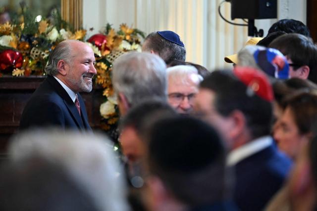 US Secretary of Commerce Howard Lutnick attends a Hanukkah reception hosted by US President Donald Trump in the East Room of the White House in Washington, DC on December 16, 2025. (Photo by ANDREW CABALLERO-REYNOLDS / AFP)