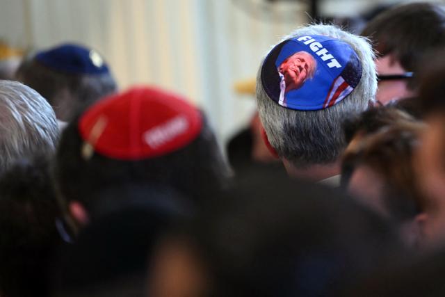 Guests attend a Hanukkah reception hosted by US President Donald Trump in the East Room of the White House in Washington, DC on December 16, 2025. (Photo by ANDREW CABALLERO-REYNOLDS / AFP)