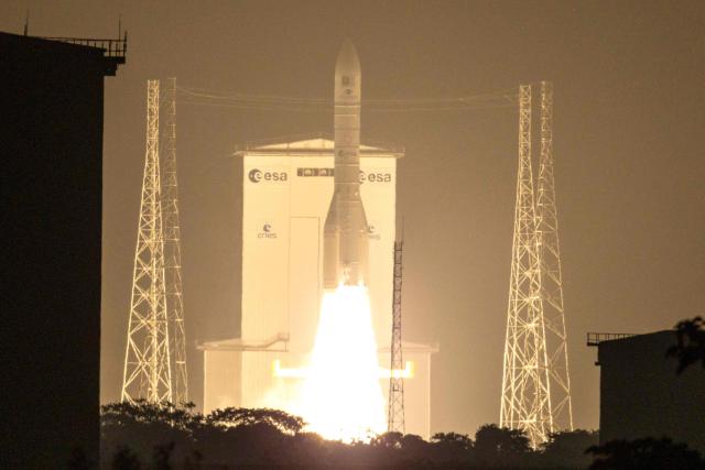 TOPSHOT - The European Space Agency (ESA) Ariane 6 rocket carrying two Galileo satellites for the the EU's Global Navigation Satellite System (GNSS) launches at the Guiana Space Centre in Kourou, on the French overseas department of Guiana, on December 17, 2025. (Photo by Ronan LIETAR / AFP)