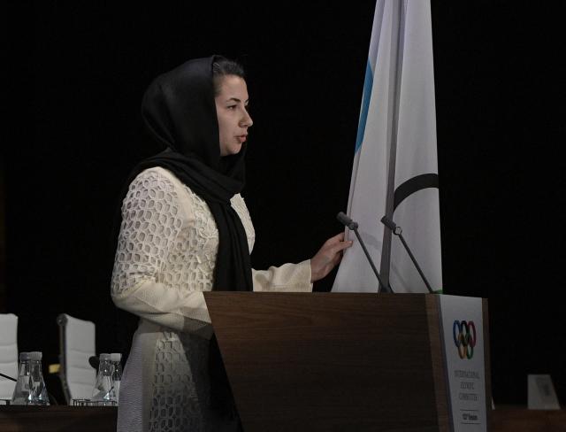 (FILES) Afghan Samira Asghari takes her oath as member of the International Olympic Committee during the 133rd IOC sessions in Buenos Aires, on October 9, 2018. Samira Asghari, the only Afghan woman member of the International Olympic Committee (IOC), says she is in favour of dialogue with Afghanistan's Taliban government to try to improve the situation of women in the country, in an email interview with AFP. (Photo by JUAN MABROMATA / AFP)