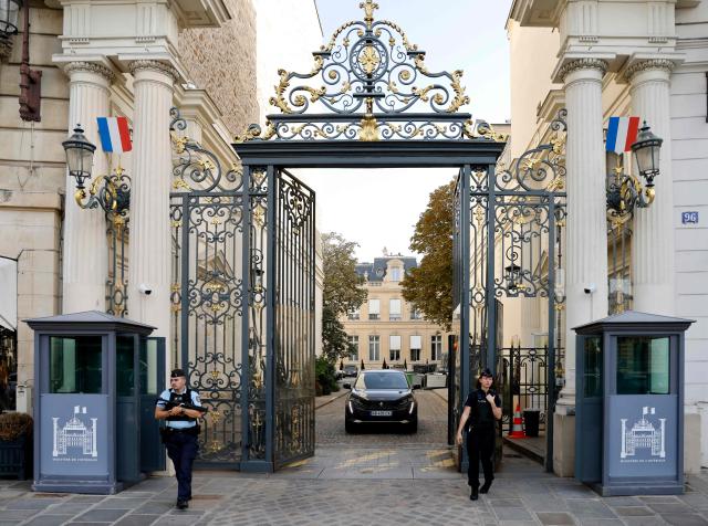 (FILES) Police officers stand guard at the entrance of the French interior ministry, place Beauvau in Paris on September 6, 2023. France's Interior Minister Laurent Nunez announced on December 18, 2025 that "A few tens" of confidential files have been "extracted" in a hacking attack on France's Interior Ministry IT infrastructure. (Photo by Ludovic MARIN / AFP)
