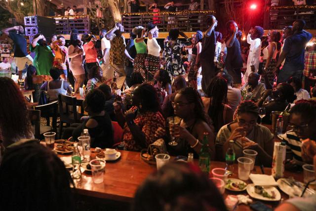 Revellers dance to Highlife Music at the Zen Gardens in Accra, Ghana, on December 16, 2025. Ghana’s famed Highlife music was inscribed this month on UNESCO's Intangible Cultural Heritage list, a major international recognition of one of West Africa's most influential musical traditions. 
UNESCO announced the decision on December 10, describing Highlife as a "monumental expression of Ghana’s musical genius, culture, and global influence", honouring generations who have preserved and adapted the genre since the early 20th century. (Photo by Nipah Dennis / AFP)