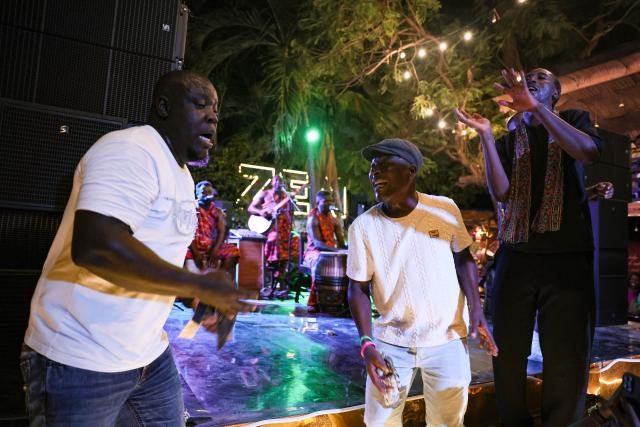 Revellers dance to Highlife Music at the Zen Gardens in Accra, Ghana, on December 16, 2025. Ghana’s famed Highlife music was inscribed this month on UNESCO's Intangible Cultural Heritage list, a major international recognition of one of West Africa's most influential musical traditions. 
UNESCO announced the decision on December 10, describing Highlife as a "monumental expression of Ghana’s musical genius, culture, and global influence", honouring generations who have preserved and adapted the genre since the early 20th century. (Photo by Nipah Dennis / AFP)
