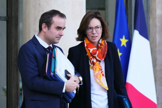 France's Prime Minister Sebastien Lecornu (L) and France's Public Accounts Minister Amelie de Montchalin leave after a weekly cabinet meeting at the presidential Elysee Palace in Paris on December 17, 2025. (Photo by Dimitar DILKOFF / AFP)