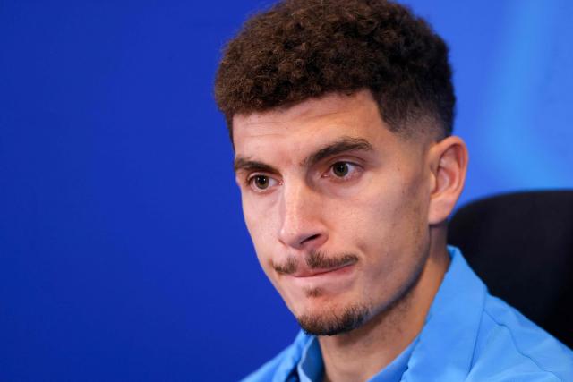 Napoli's Italian defender #22 Giovanni Di Lorenzo listens to a question during a press conference on the eve of the Supercoppa Italiana semi-final football match between Napoli and AC Milan at the King Saud University Stadium in Riyadh on December 17, 2025. (Photo by Fayez NURELDINE / AFP)