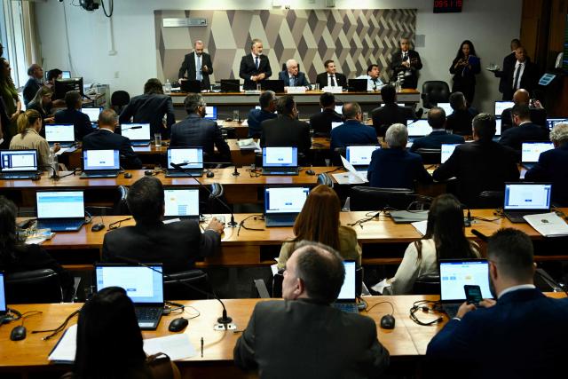 General view of the Senate Constitution and Justice Committee discussing the bill that reduces the sentences of those convicted of attempted coup d'etat in Brasilia, on December 17, 2025. Brazil's Senate is debating a bill passed by the lower house of Congress that could slash the jail term of former president Jair Bolsonaro, a move that sparked nationwide protests over the weekend. (Photo by Evaristo Sa / AFP)